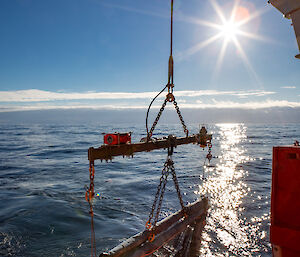 A net suspended on a steel wire behind the back of a ship.