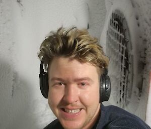 Braiden, one of the Mawson diesos de-blizzing a vehicle