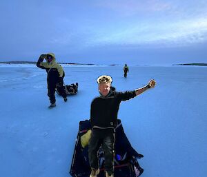 A mock-up of a Mawson expeditioner pretending to be a on a sled ride