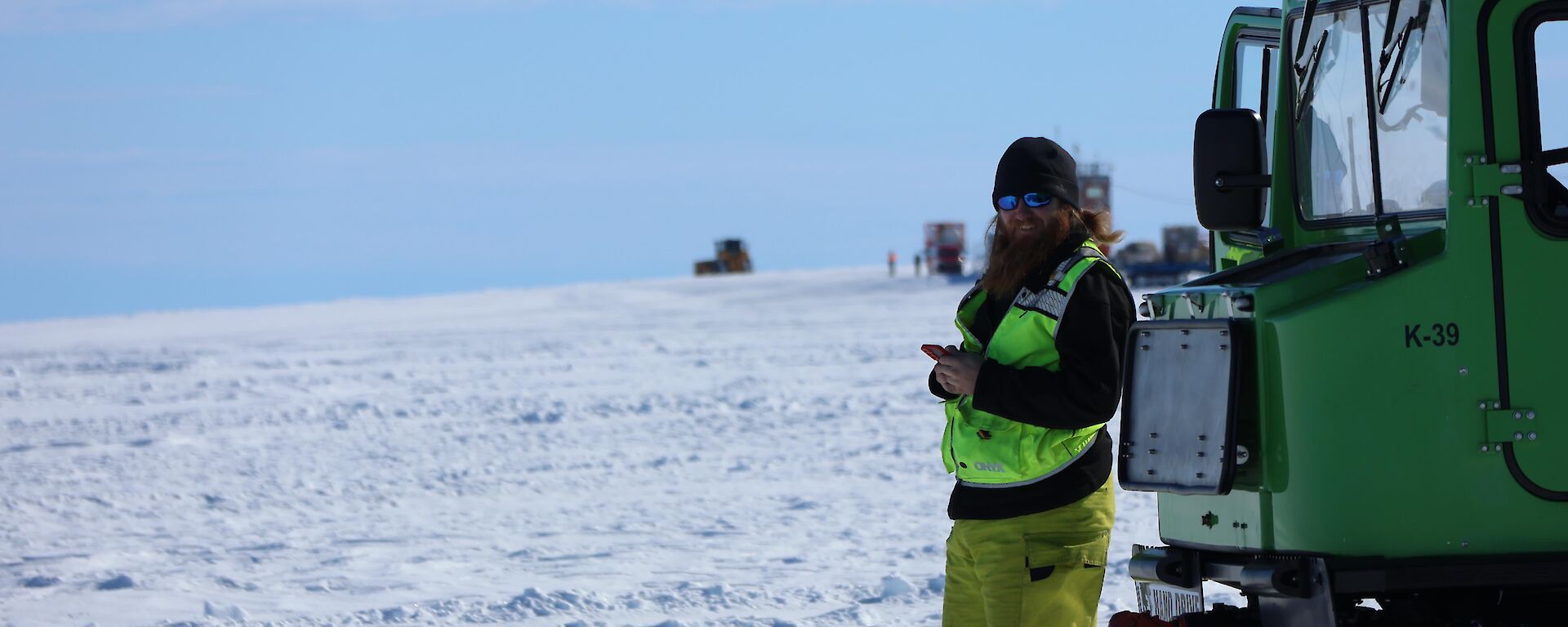 Peter wearing Emergency response turn out gear aside the runway for a flight