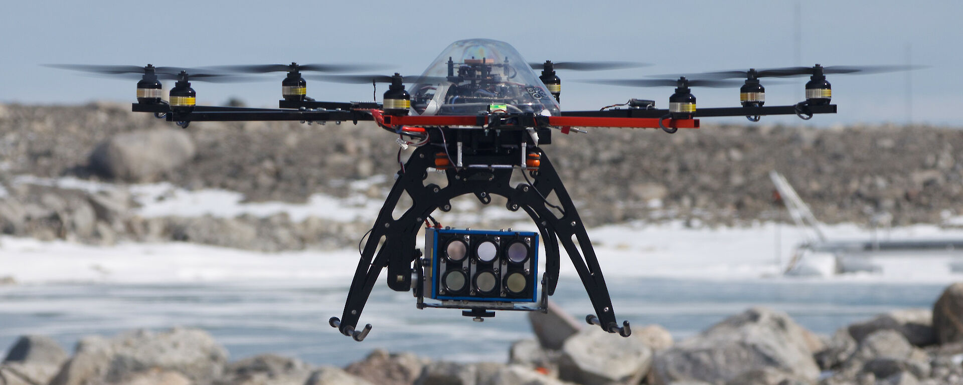 Close-up of an octocopter drone hovering in the Antarctic environment