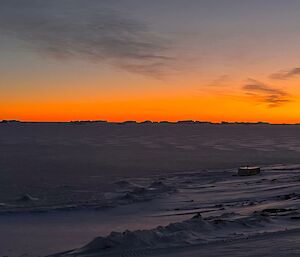 An icy landscape at sunset