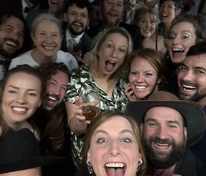 Selfie taken that fits in 21 expeditioners, all gathered close and with very big smiles