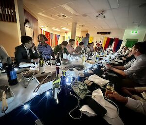 the Casey station team pictured sitting at the dinner table enjoying each others company
