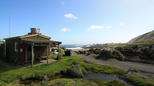 Bauer Bay field hut on a sunny day
