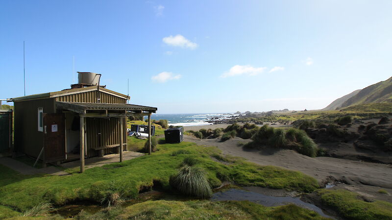 Bauer Bay field hut on a sunny day