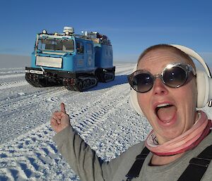 a self captured image of san pointing to the hagg during a trip to Wilkins aerodrome with clear skys and open roads