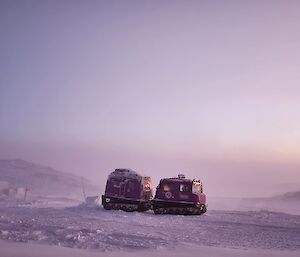 a hagglaund vehicle parked in the foreground of a landscape of Newcombe bay