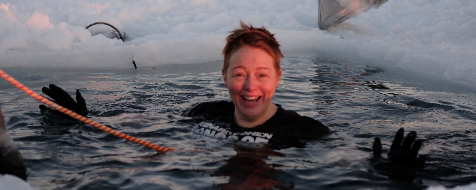 San submerged in the sea ice hole during the mid winter swim