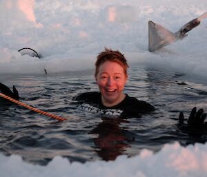 San submerged in the sea ice hole during the mid winter swim