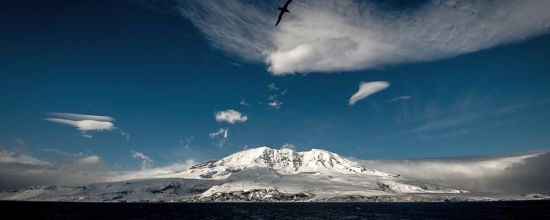 View of snow-capped Heard Island from the ocean