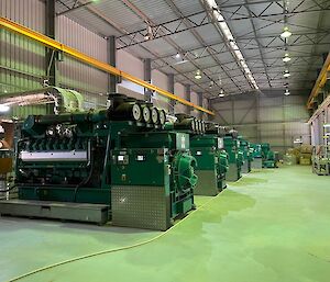 a view inside a very large industrial shed housing power generators