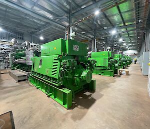a view inside a very large industrial shed housing power generators