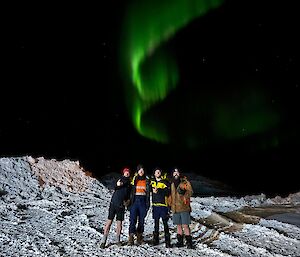 Pictured LR - Mitch, Josh, Matt, Chris standing in front of the red shed with the aurora australis in the night sky