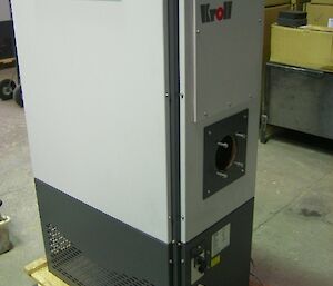 Kroll heating machine which is a vertical airconditioning type heat exchanger that runs of waste oils is pictured prior to original installation from earlier days looking new and capable