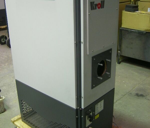 Kroll heating machine which is a vertical airconditioning type heat exchanger that runs of waste oils is pictured prior to original installation from earlier days looking new and capable