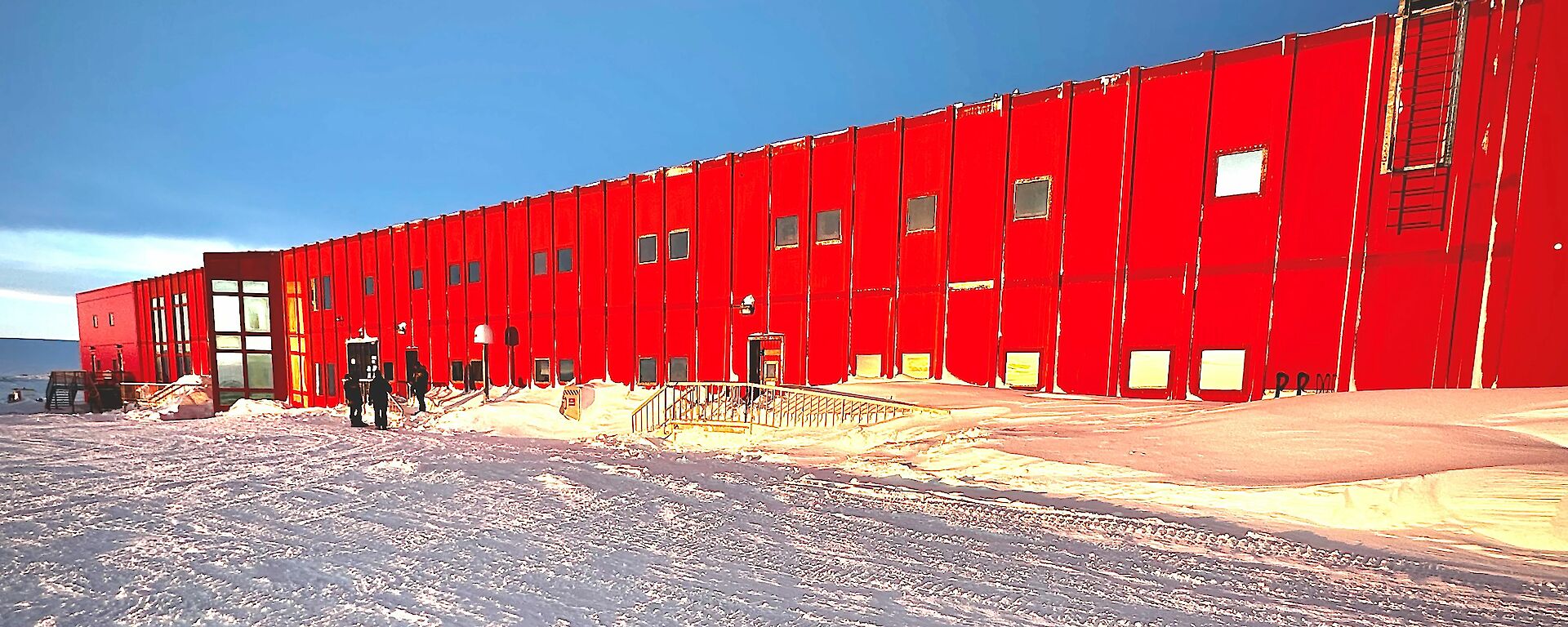 A large red metal building