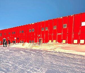 A large red metal building