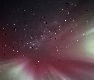 Aurora burst of crimson, white and green above Mawson during May