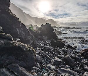 Large boulders along a shoreline with rough seas