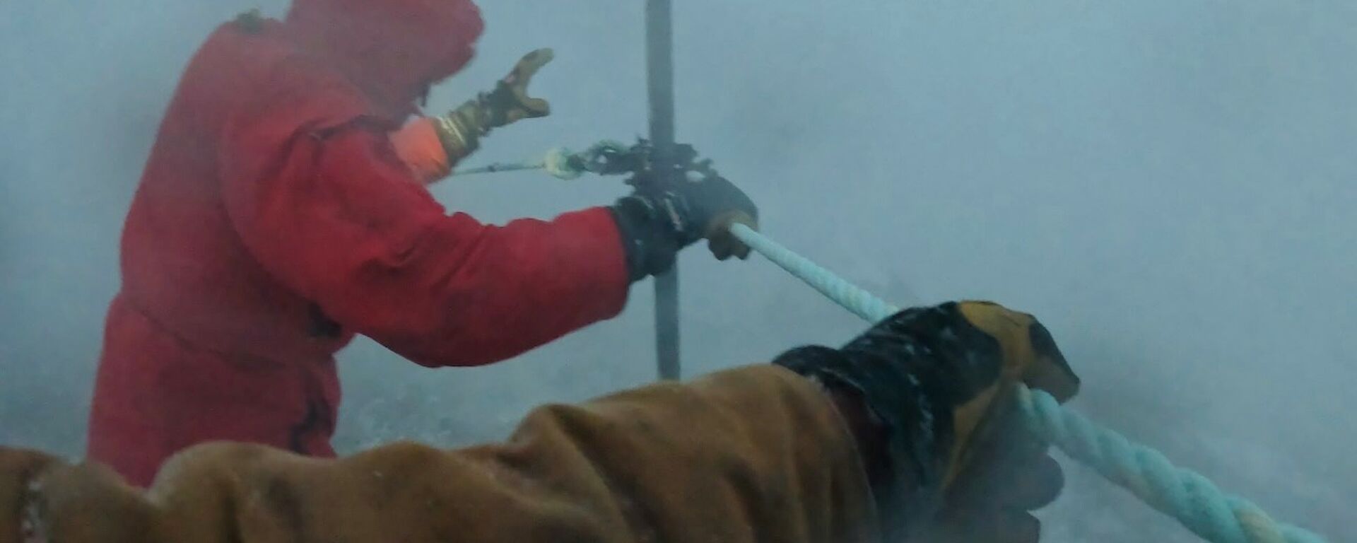 A person in red in a snow storm