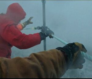 A person in red in a snow storm