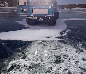 A Hagg tractor stands on a frozen lake