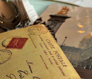 French inspired place setting with postcards of Paris on the plate