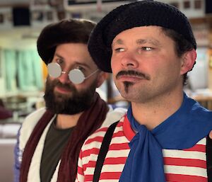 Men dressed as typically french with berets, striped shirt, mow and beard