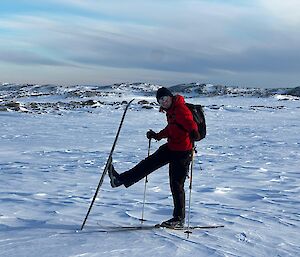 Alex with his skis on out on the local bailey peninsula. vast array of cloud display in the background.