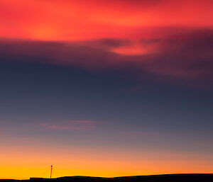 Clouds lit orange by a sunset