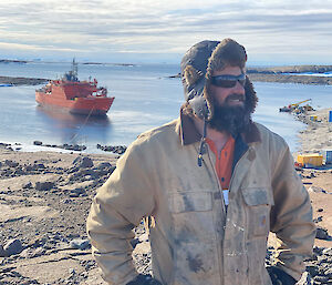An orange icebreaker ship in the bay at Casey Station