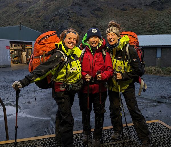 Three smiling women with packs on