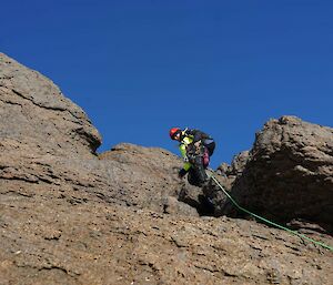 A person climbing a rock side