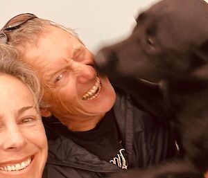 A self captured image of the family, Billy, Tui the dog giving Rob Billy's husband a big kiss.