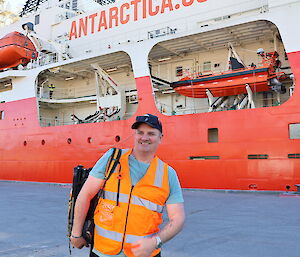 Dael standing at the ship in dock at Hobart