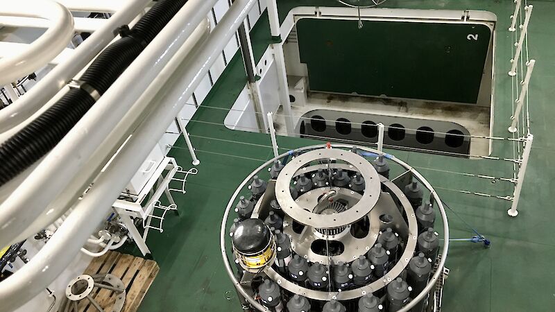 Looking down on to the deck of a ship that contains a CTD instrument and square moon pool