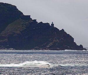 Locking across the water towards the tip of the land.  A tower can be seen on the land