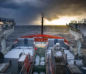 Looking on to the deck of a ship with lying snow on it