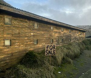 A run-down brown weatherboard building