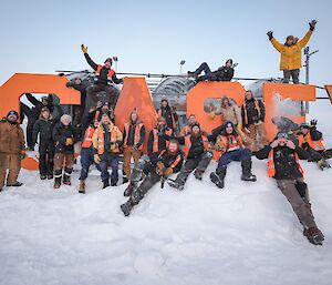 a view of the trades team scattered among the Casey sign located at the lower fuel farm down by the wharf