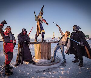 5 expeditioners with star wars costumes perform 'battle like' poses on may the 4th a reference to the epic space opera