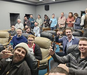 a self captured image of the Odeon move theater where expeditioners are gather to view the Winter International Film Festival of Antarctica (WIFFA) Movie Premiere