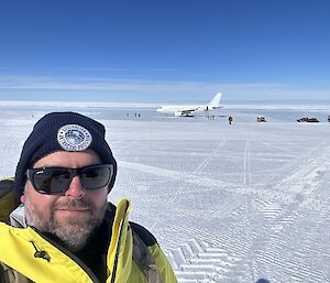 A stunning self captured image of James after landing at the Wilkins aerodrome. clear nearly cloudless sky's and white contrasting snow