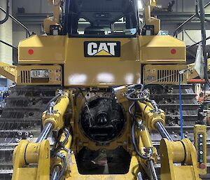 A dozer machine with a view into the transmission from the back end