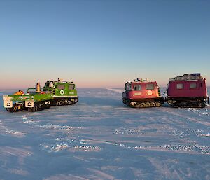 Two Hägglunds vehicles captured on the Icy plateau