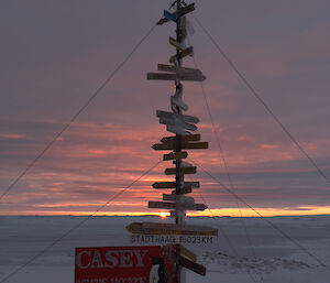 A sunrise dawns behind the Casey sign