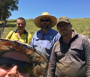A self captured image of James and family out in the land doing fence work