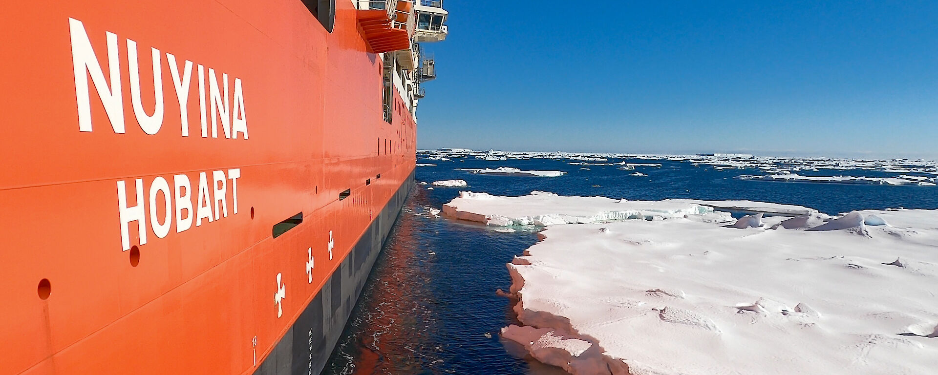 View from the side of the Nuyina as it sails through the ice