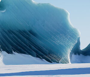 A stunning blue/green iceberg or jade berg trapped in the sea ice between Mawson and the Colbeck Archipelago